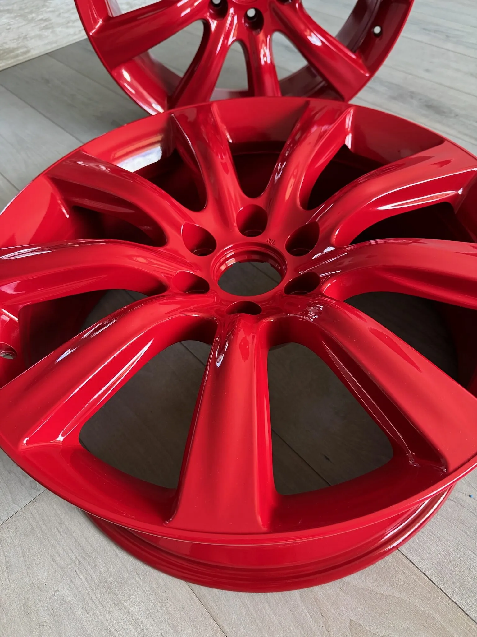 Wheel powder coated in gloss red, close up